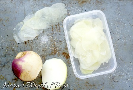 A 2 part image showing peeled turnips being sliced on a mandoline